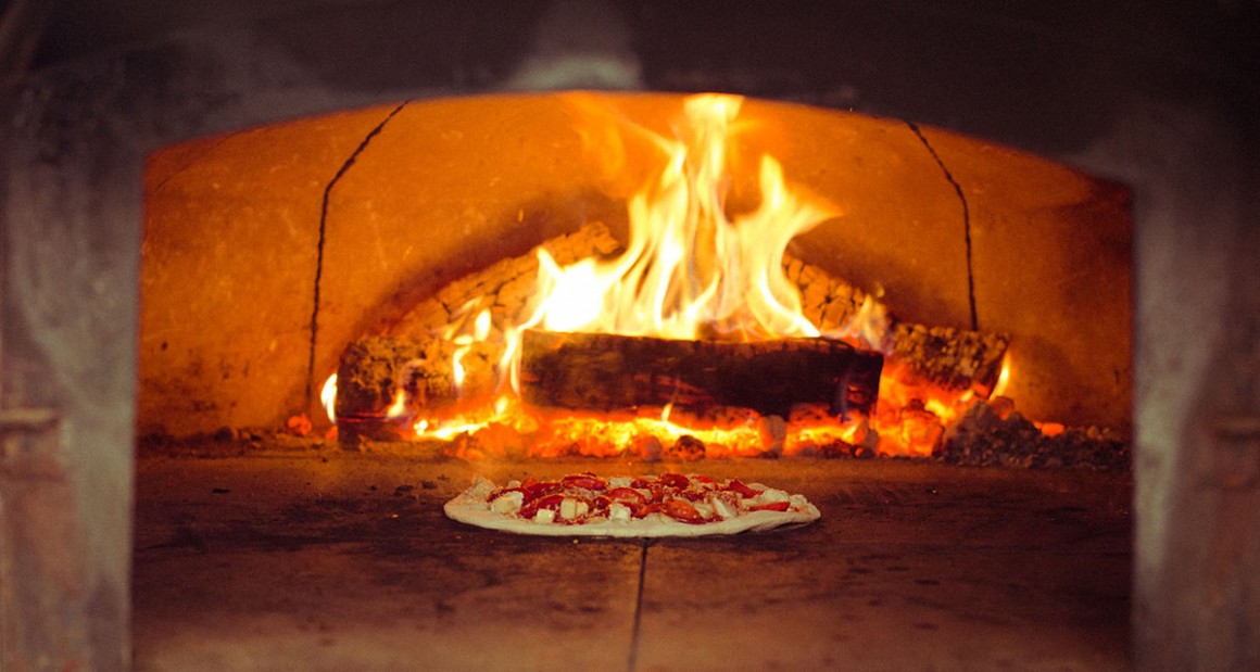 Pizza being fired in the oven. Photograph by William Hereford