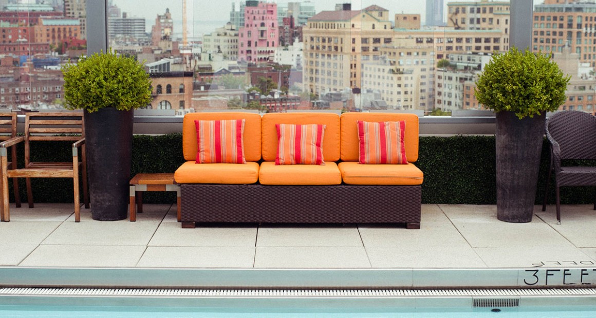 Poolside lounging with the city as a backdrop. Photograph by William Hereford