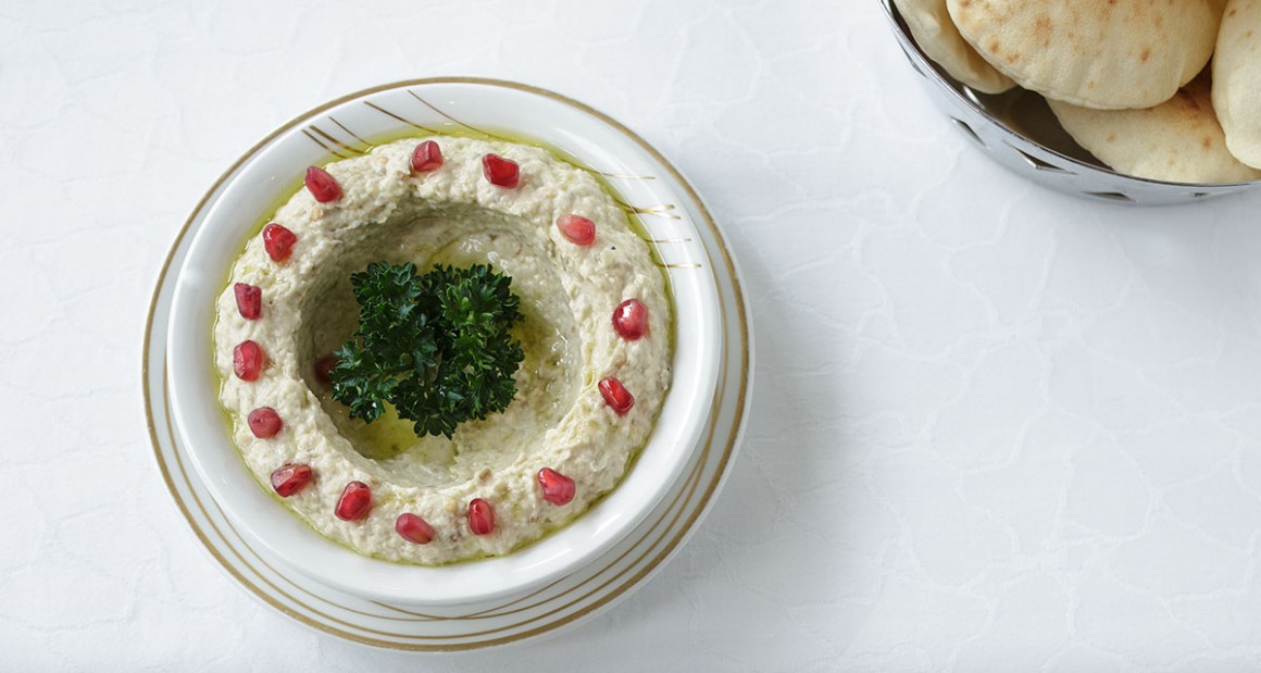 Eggplant with tahini, olive oil, pomegranate, and parsley. Photograph by Walter Shintani.